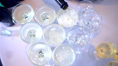 Table with glasses with champagne wine for wedding ceremony. Waiter pours Stock Footage 101329358