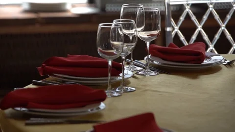 On the table with a Golden tablecloth are white plates, wine glasses 스톡 동영상 103469717