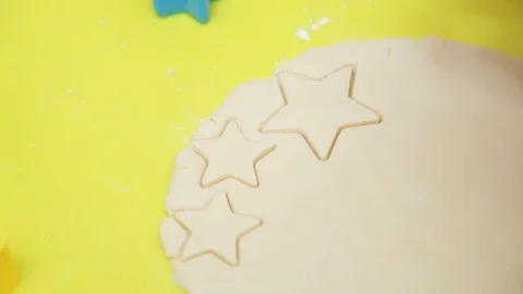 On table hands young girl making cookies with colorful forms in home smile sweet Stock Footage 99372507