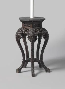 Table with hexagonal leaf and substructure, on S-shaped legs, decorated wi... Stock Photos