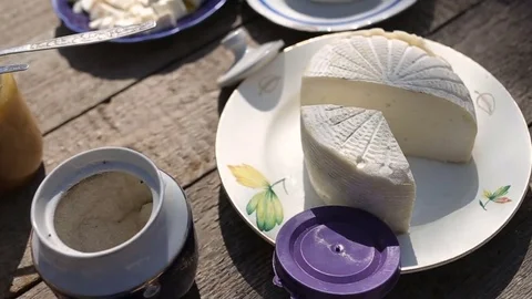 Table with home cheese Stockbeeldmateriaal 82764442