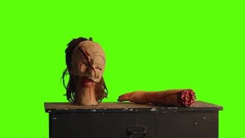 Table of horror on a green screen Stock Footage 75168924