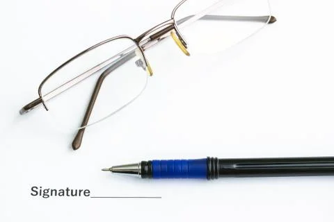 On the table is an important document, pen and glasses Stock Photos
