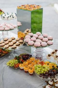 Table laden with assorted desserts and pastries Stock Photos