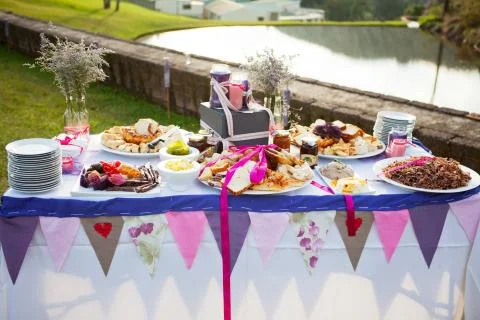 Table laid with fresh bread and condiments at wedding Foto stock
