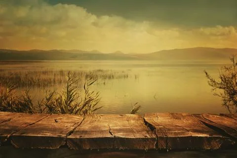 Table with lake and cloudscape art design Stock Photos