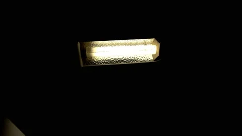  table lamp with an energy-saving fluorescent lamp that turns on and off Stock Footage 202591766