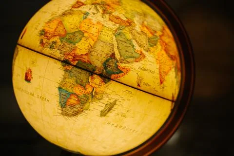 A table lamp in the form of a globe, a rotating globe of the earth. Georgafia of Stock Photos