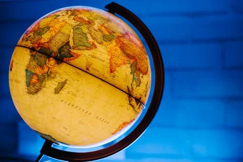 A table lamp in the form of a globe, a rotating globe of the earth on a Stock Photos