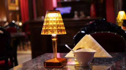 A table lamp on a table in a restaurant Stock Footage 292491233