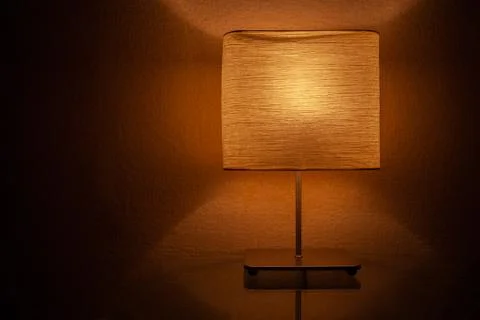 Table lamp turned on at night Stock Photos