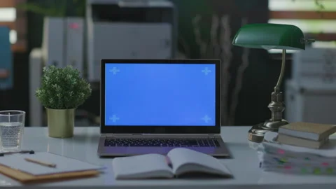 Table with laptop and notebook in modern office Video stock 219709662