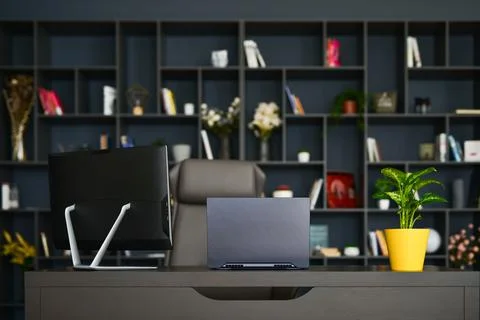 Table with laptop in home office interior. Stock Photos