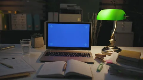 Table with laptop, notebook and lamp in modern office Stock Footage 219733283
