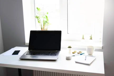 A table with laptop. Stock Photos