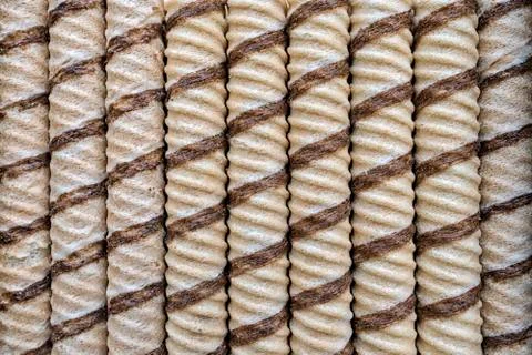 On the table lie waffle tubes, background and texture Stock Photos