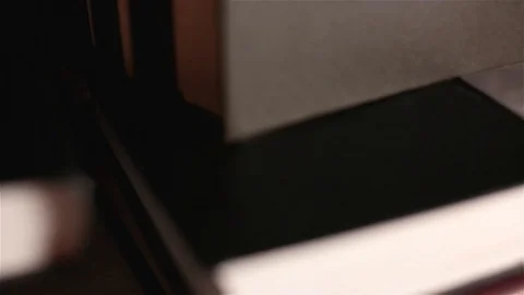 On the table lies the Bible, and on it the crucifixion of Jesus Christ Stock Footage 100871001