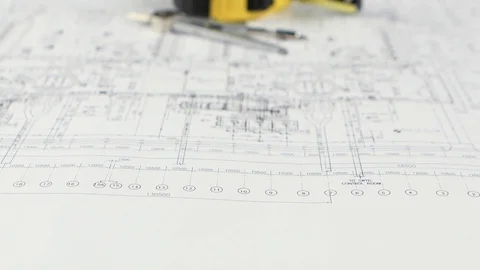 On the table lies a divider, measuring tape and drawing. Close up Vidéo 73670638