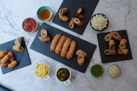 A table with many different types of food and drinks Stock Photos