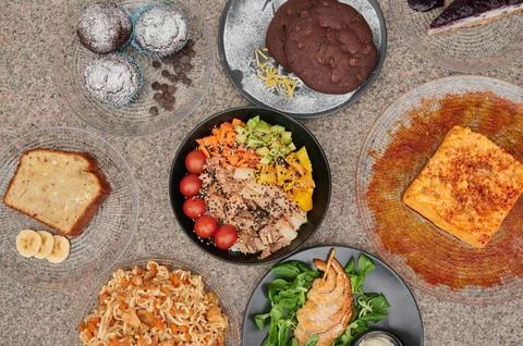 A table with many different types of food on it Stock Photos