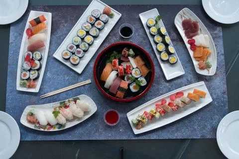 A table with many different types of sushi Stock Photos