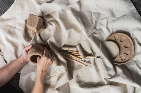 Table with materials and tools for pottery making craftsperson workspace Stock Photos