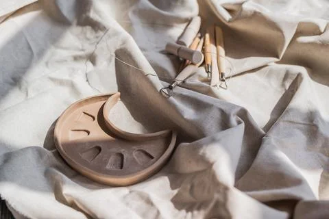 Table with materials and tools for pottery making craftsperson workspace no Stock Photos