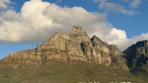 Table Mountain, Cape Town, as seen from Camps Bay in the late Afternoon summer Stock Footage 331391491