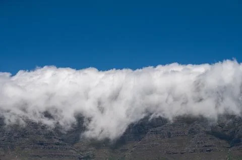 Table mountain covered with cloud of fog Stock Photos