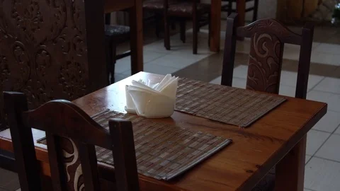 Table with napkins. in an inexpensive restaurant. table without people. Video stock 123008040