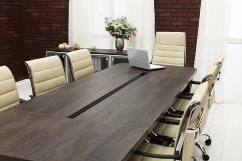 Table for negotiations with the laptop Stock Photos