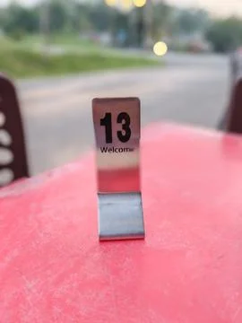 Table Number 13 on Red Caf Surface Stock Photos