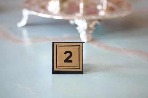 Table number two is displayed on a restaurant table Stock Photos