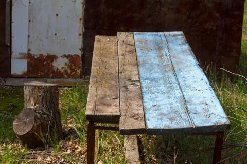 Table from old boards on the background of nature on the old farm Stock Photos