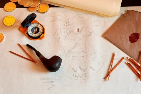 Table with an old treasure map, smoking accessories, compass, and coins Stock Photos
