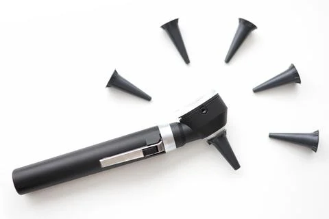 On table is an otoscope with replaceable attachments Stock Photos