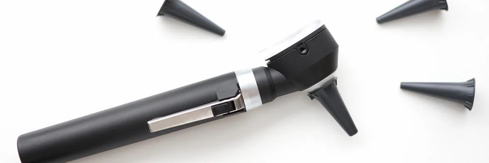 On table is an otoscope with replaceable attachments Stock Photos
