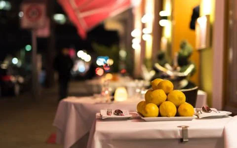 A table outside in the restaurant in the evening Stock Photos