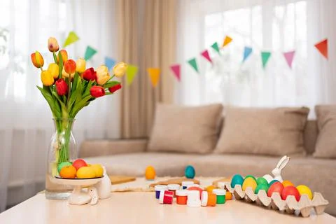 Table with paints and decorated Easter eggs. table setting. Stock Photos