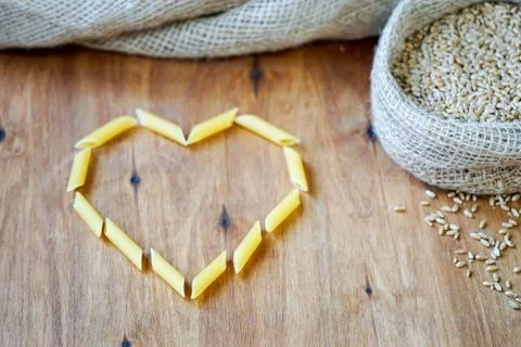 On the table, paste is a figure of the heart. Stock Photos