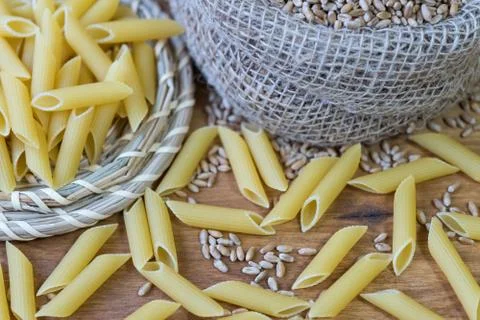 On the table, the paste is scattered on the wooden surface. Stock Photos