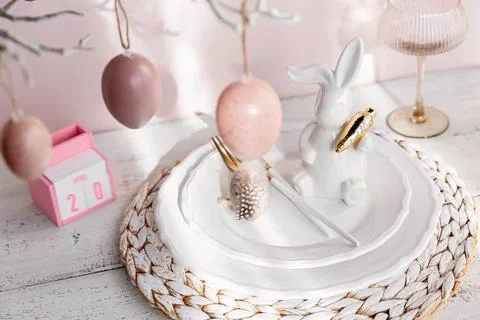 Table place setting with easter bunny figure, eggs and wooden Perpetual cal.. Stock Photos