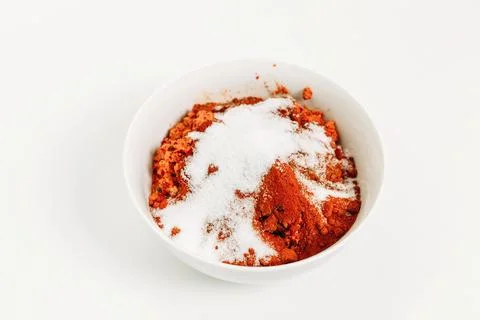 On the table in a plate there is a vegetable mixture covered with salt for .. Stock Photos