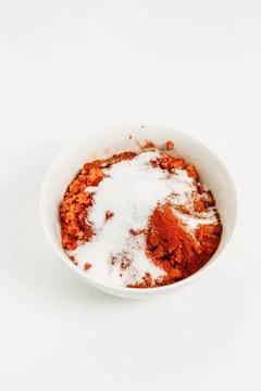 On the table in a plate there is a vegetable mixture covered with salt for .. Stock Photos