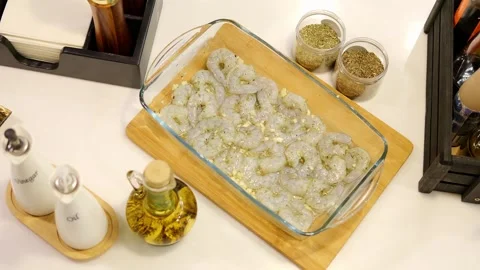 On the table, a platter of succulent shrimp awaits. The camera in, capturing the Video stock 270037534