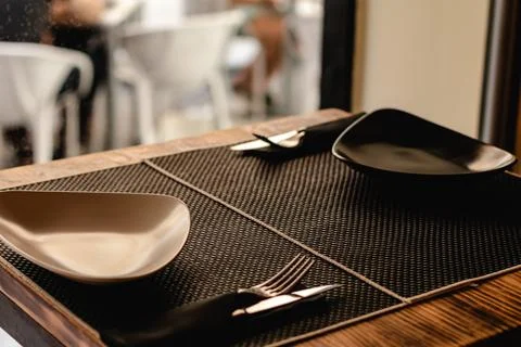 Table prepared for customers in restaurant Stock Photos