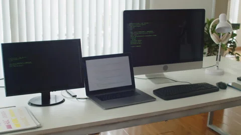 Table of Programmer with Computers with Codes in Testing Mode on Screens Stock Footage 256974165