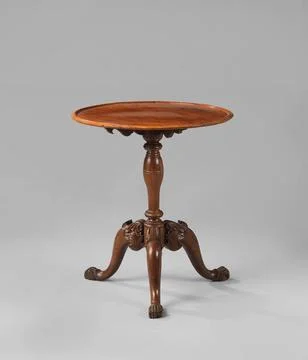 Table with protected around leaf on baluster-shaped strain with three S-sh... Stock Photos