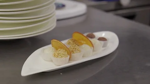 On the table to remove the client lie candy in a package on a plate Video stock 75817393