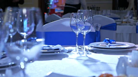 Table at restaraunt with glasses.Wedding white table appointments ready for Stock Footage 122127259